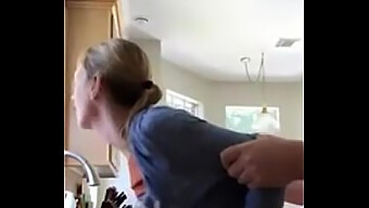 A Mature Woman Engages In Sexual Activity In The Kitchen