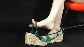 Close-Up Of Asian Feet Wearing Espadrille-Inspired Sandals. Magnified View.