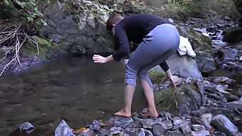 College Coed Braves Cold River In Winter, Shivering At 60 Fps